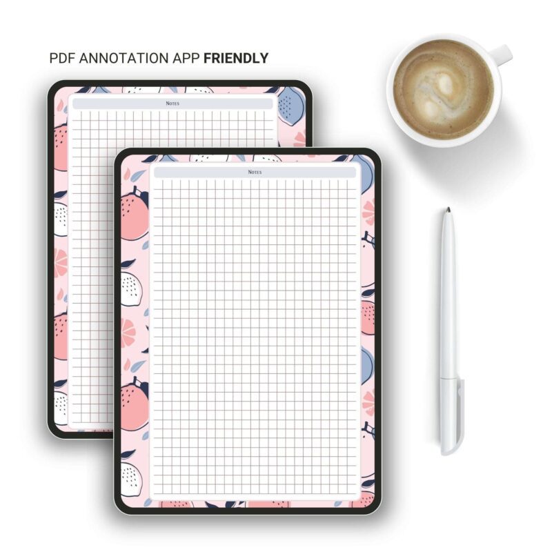 A5 Grid Notes Planner Insert on a wooden desk with a pen