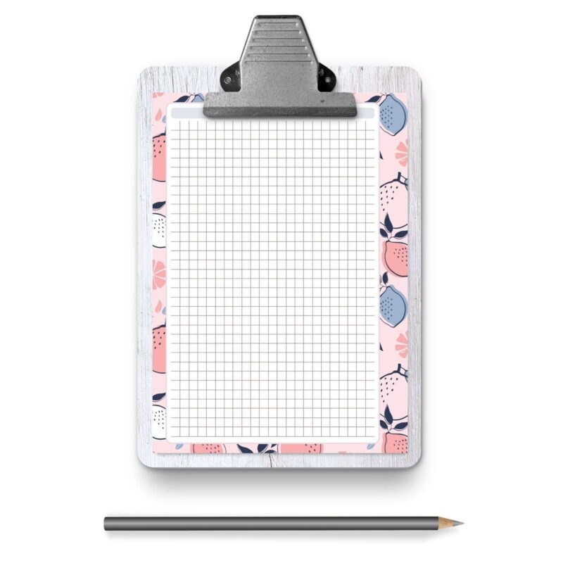 A5 Grid Notes Planner Insert on a wooden desk with a pen
