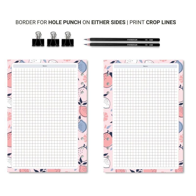 A5 Grid Notes Planner Insert on a wooden desk with a pen
