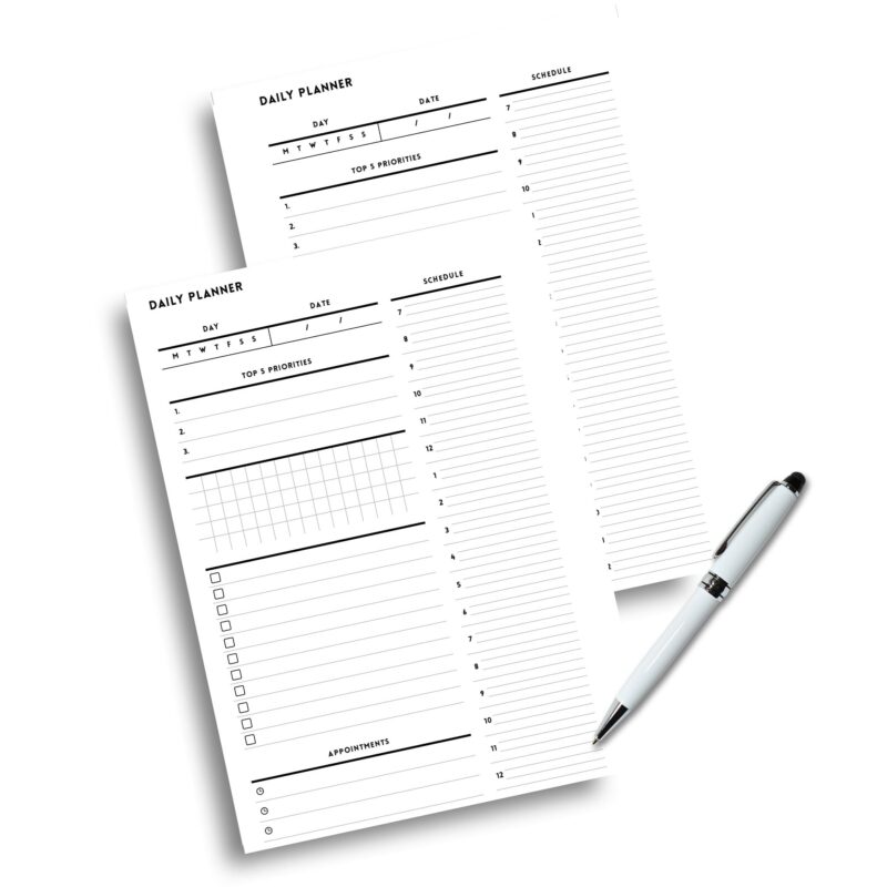 Stack of printed A5 Minimalist Daily Planner pages.