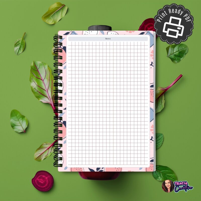 A5 Grid Notes Planner Insert on a wooden desk with a pen