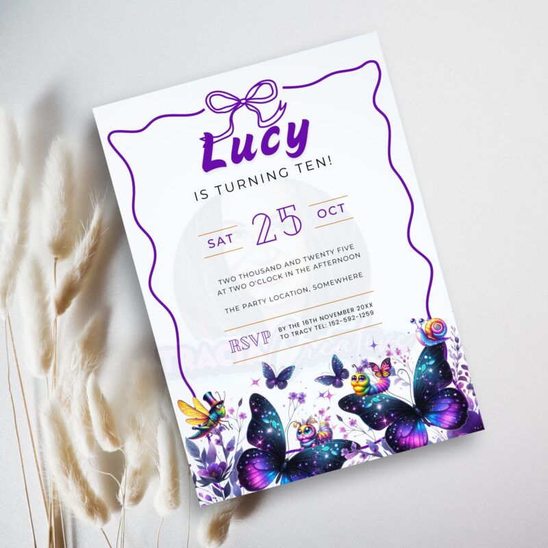 Purple butterfly birthday invitation on party table