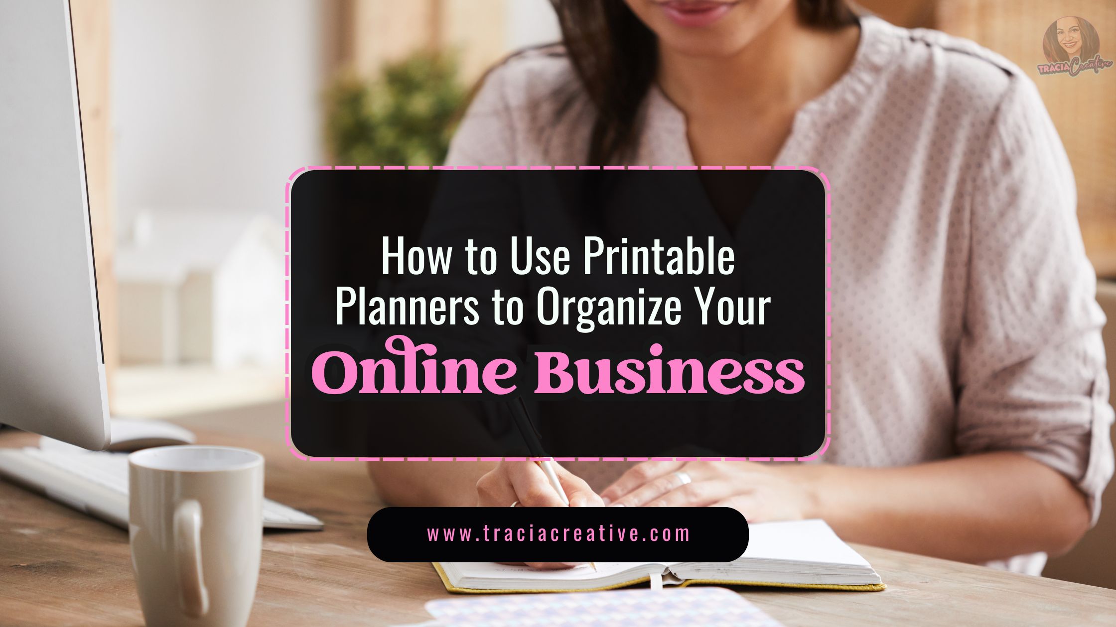 person writing in a printable planners with a laptop in the background, illustrating online business organization