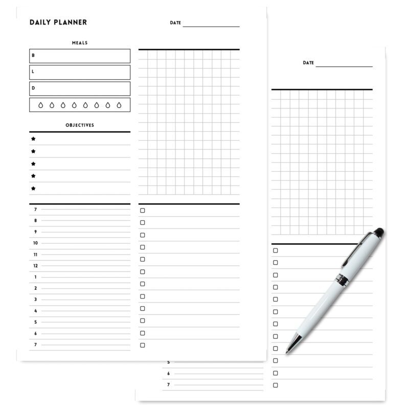 Top-down view of an A5 daily planner open to the objectives and notes sections.