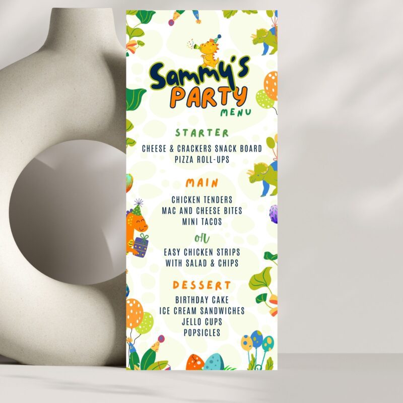 A printed birthday party menu standing on a food buffet table.