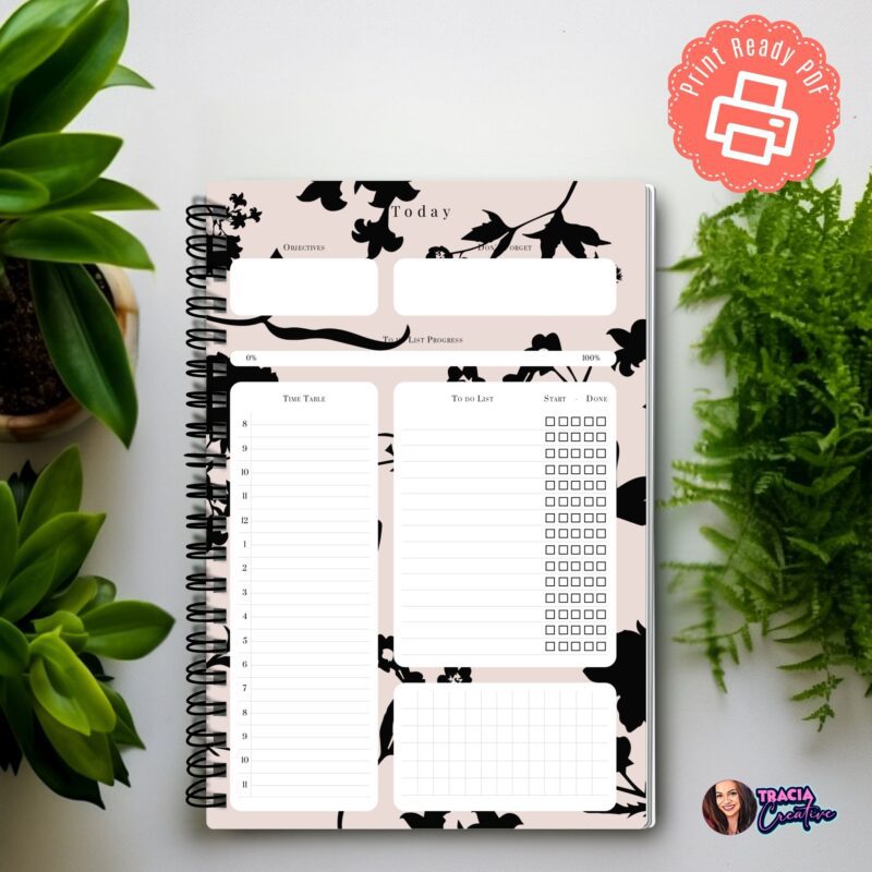 A5 Daily Project Planner open to a day's objectives and tasks section.