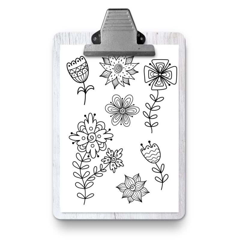 Printed coloring pages with colored pencils nearby