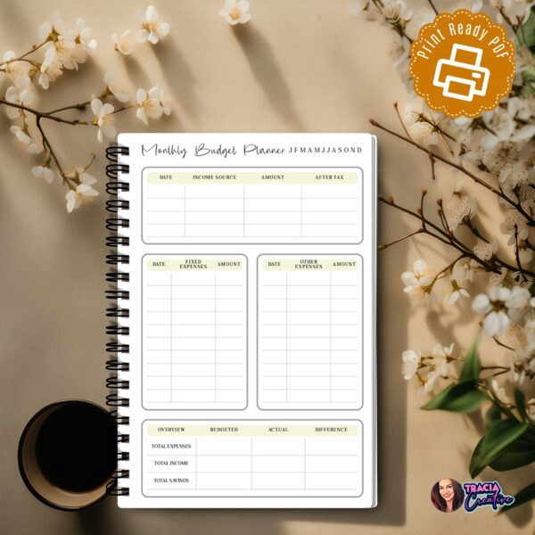 A5 Monthly Budget Planner laid flat with pen
